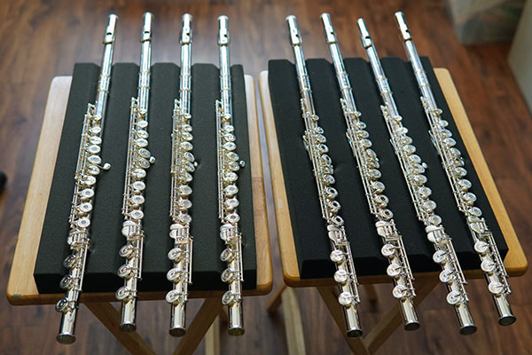 A small selection of appropriate higher-level flutes presented to a student - Emily Gurwitz can help you selecting and buying a flute upgrade in your price range. A selection of appropriate higher-level flutes presented to a student